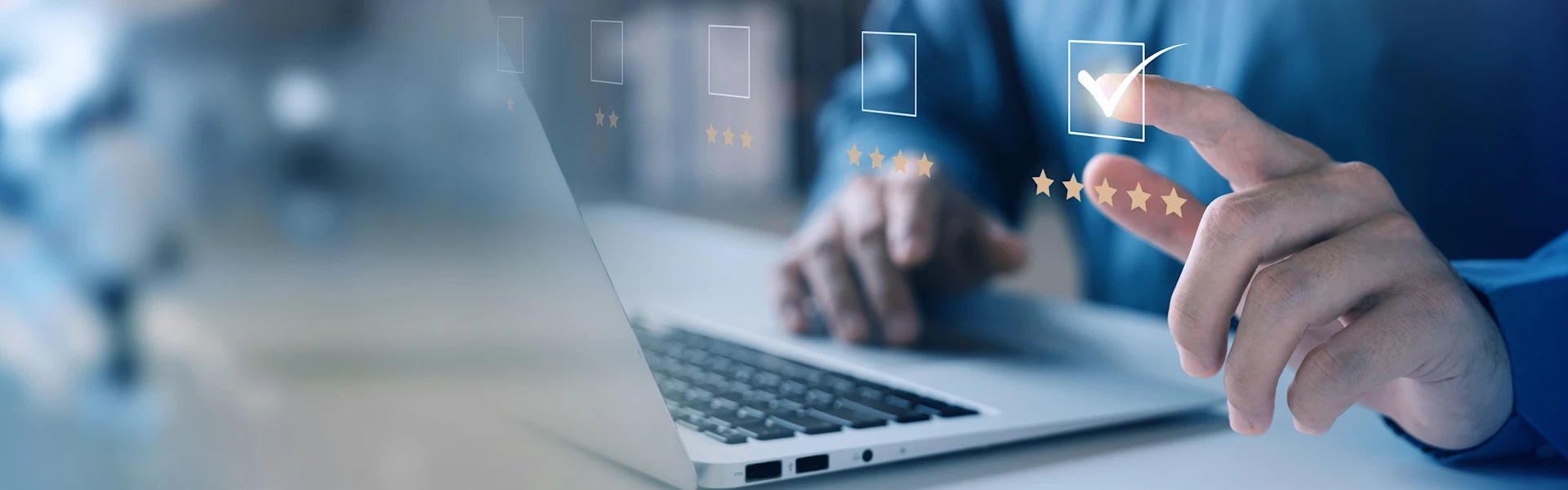 Hands on the laptop clicking on virtual rating boxes. 5 stars are clicked.