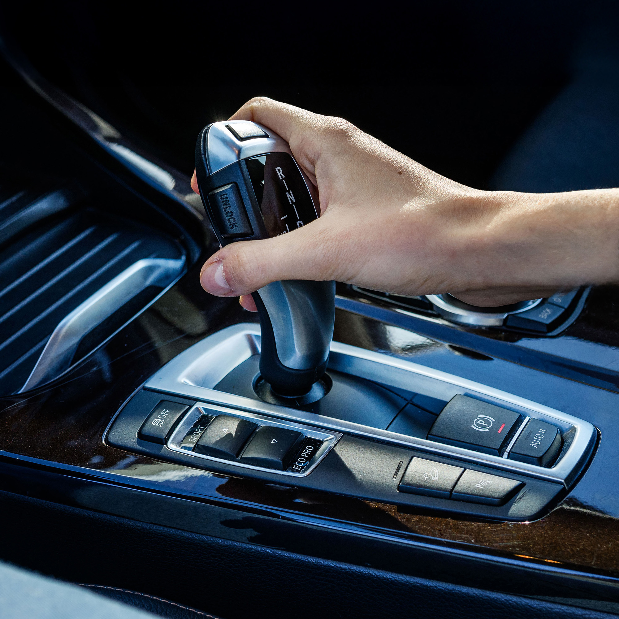 Vehicle interior with an automatic gear selector, illustrating everyday use of an automatic transmission.