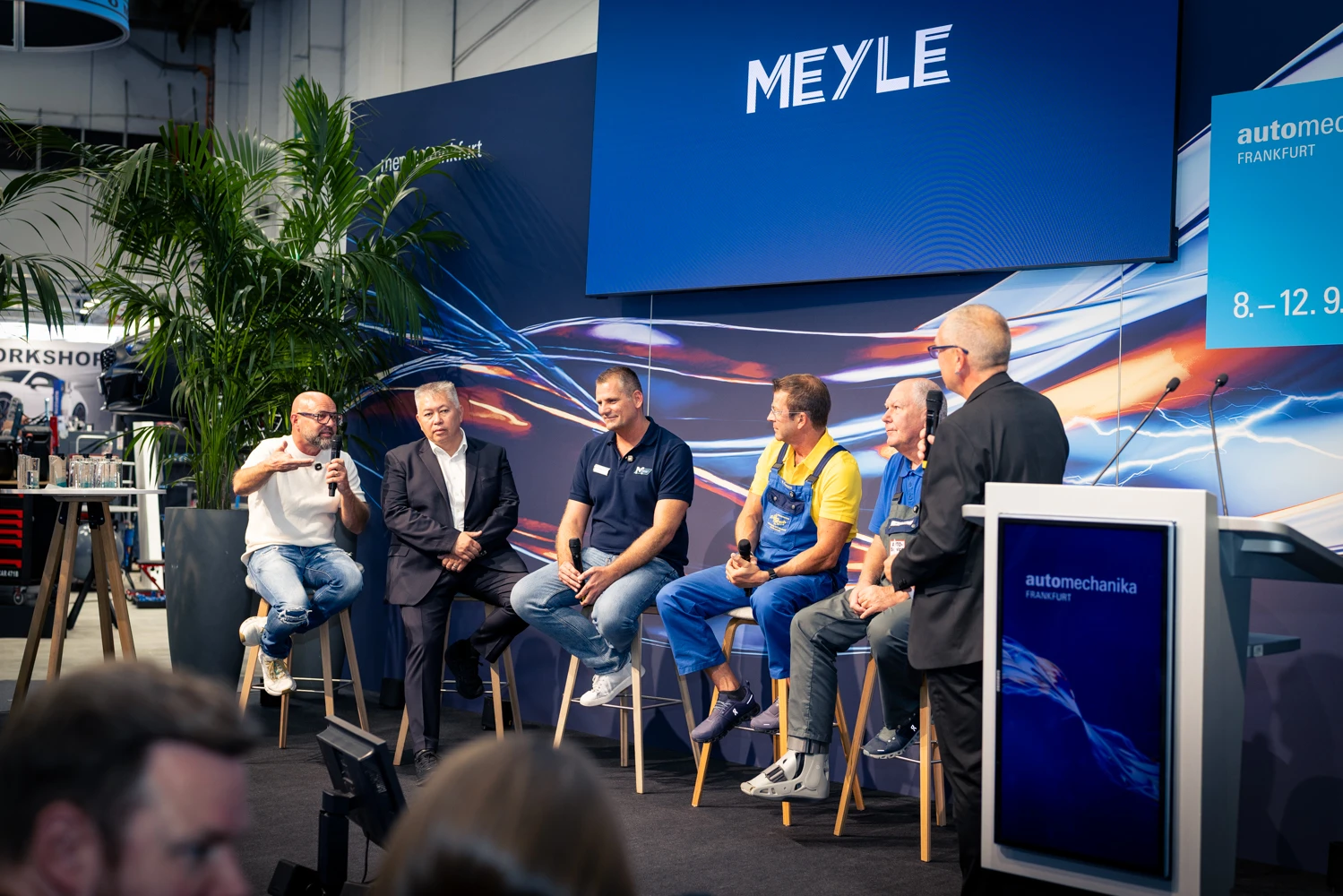 Four people speak at a panel discussion.