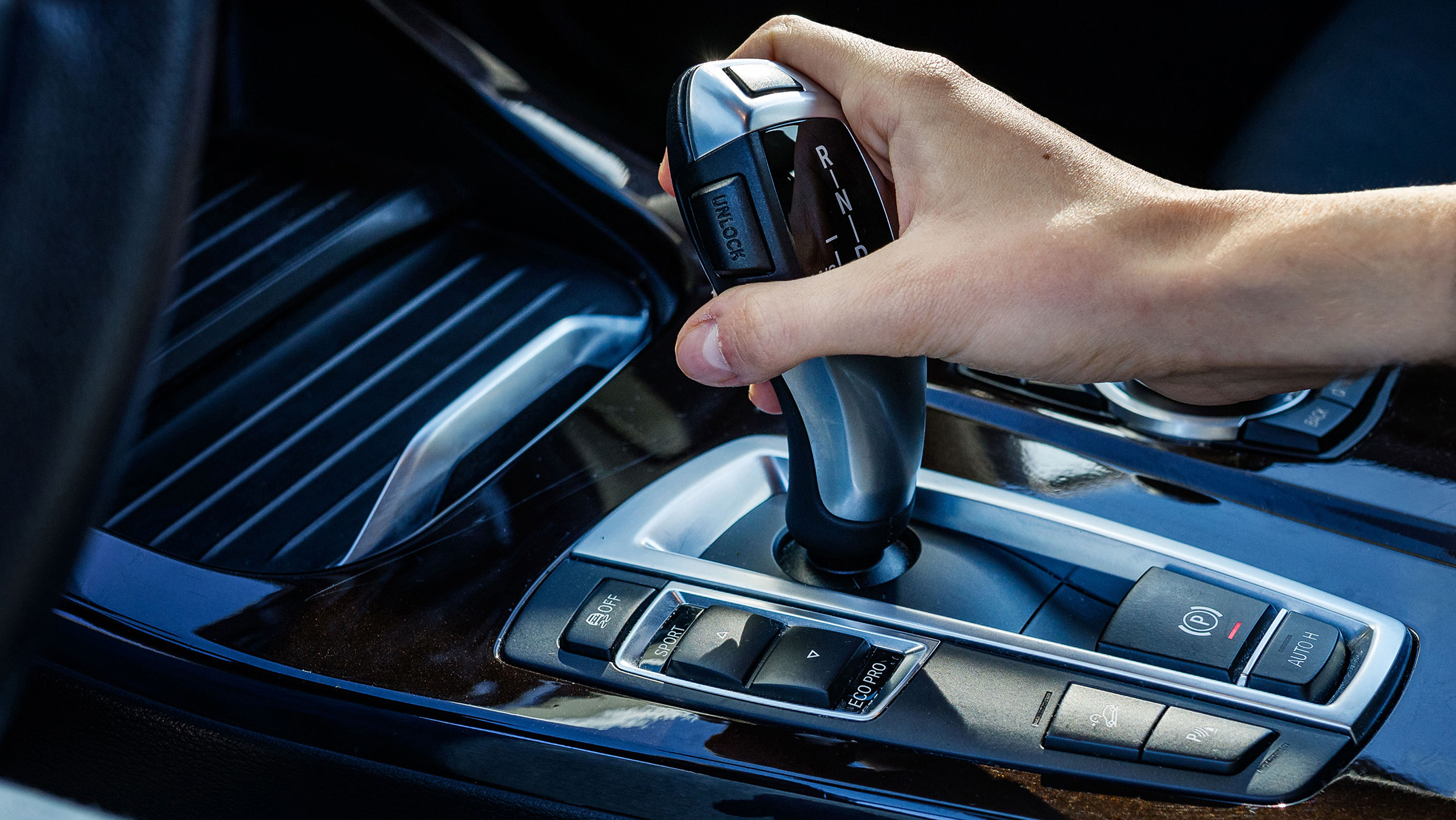 Vehicle interior with an automatic gear selector, illustrating everyday use of an automatic transmission.