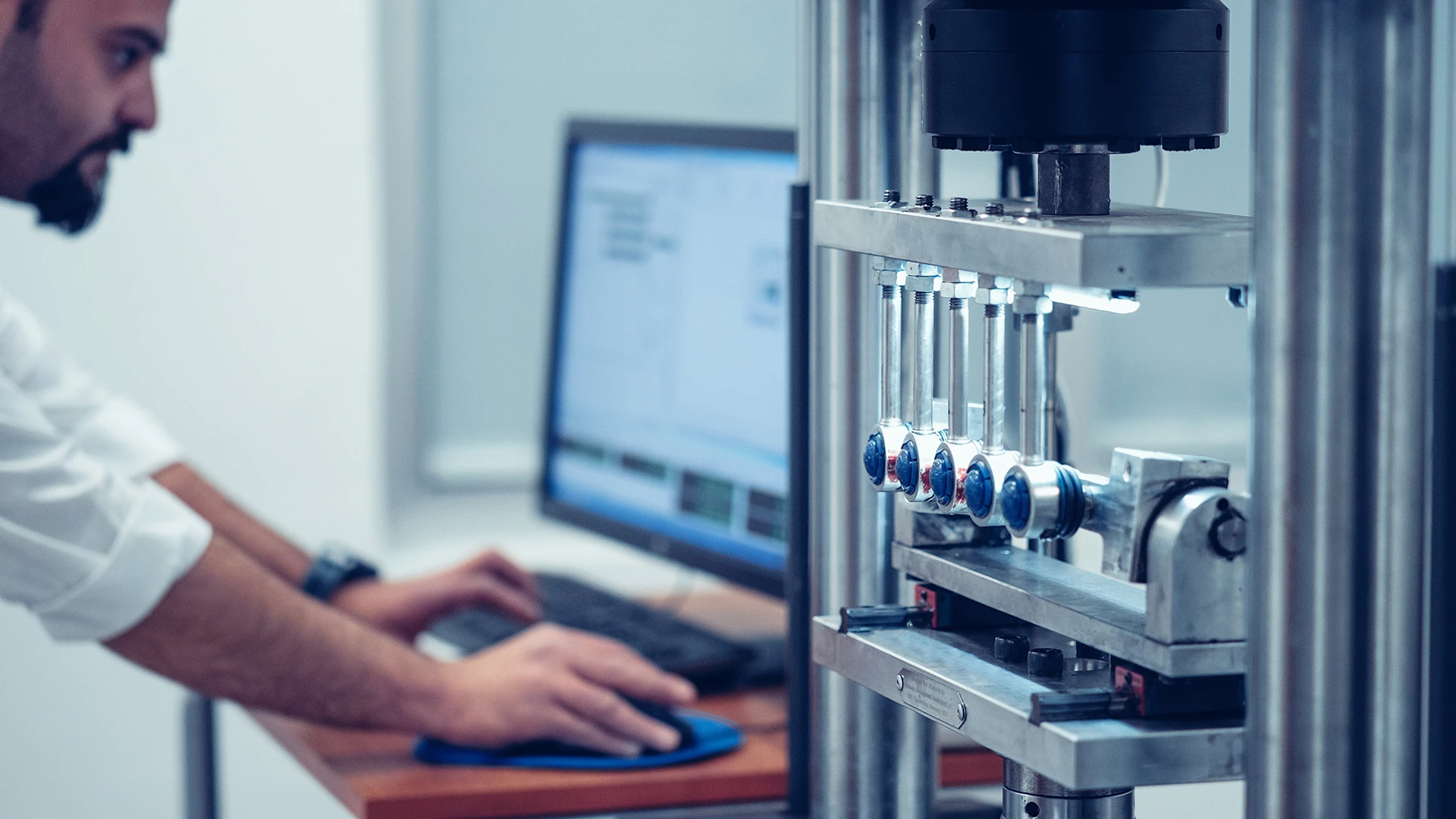 Person checks the data of a quality inspection by a machine on the monitor.