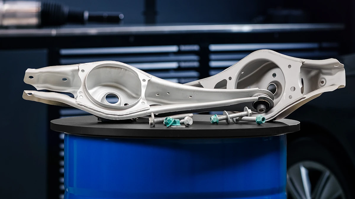 Photo of two MEYLE rear axle control arms for Golf 7 and 6 in a workshop environment.